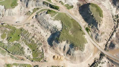 top down aerial view over badlands in alberta, canada