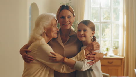 three generations of women embracing affectionately
