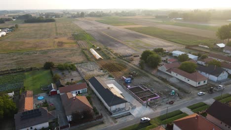 drone view of house plot during early morning foundation phase construction