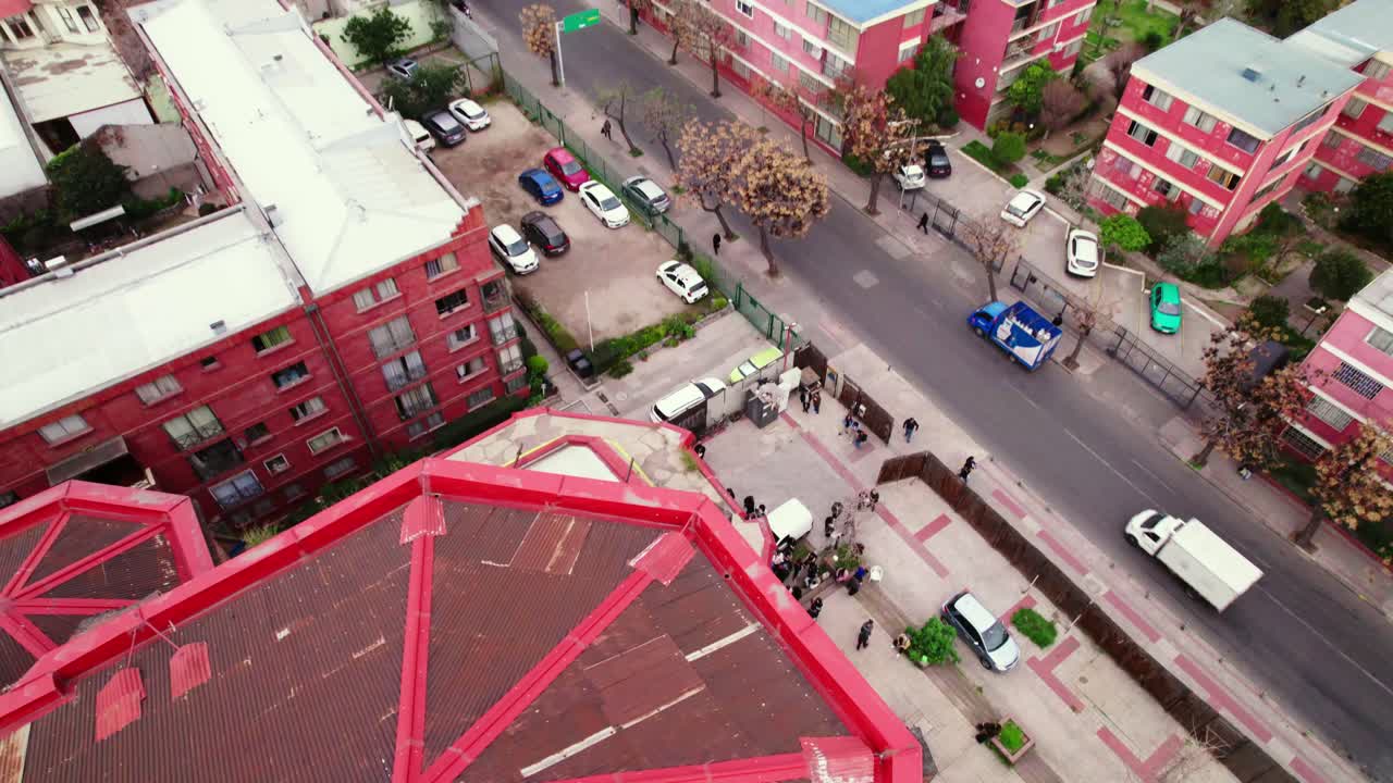 Tilt down establishing of a group of people waiting to enter the back of the Basilica of the Savior, part of the structure's ambo