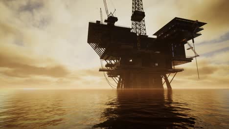 offshore jack up rig in the middle of the sea at sunset time