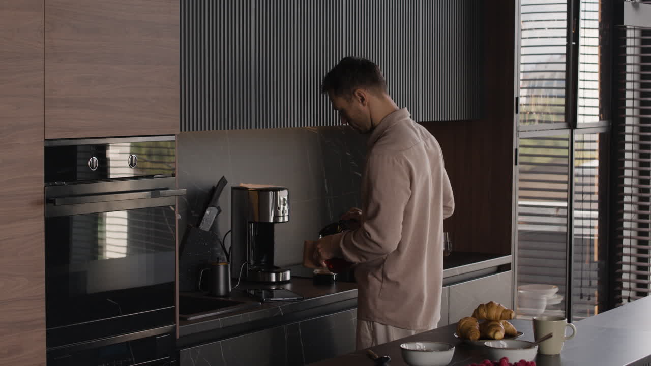 Man making coffee in a modern kitchen