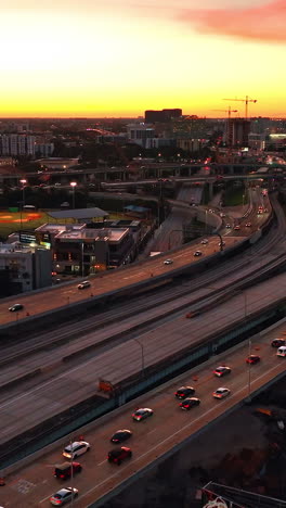 lively vibrant city scenery at the end of the day. miami landscape at sundown from aerial perspective. vertical video
