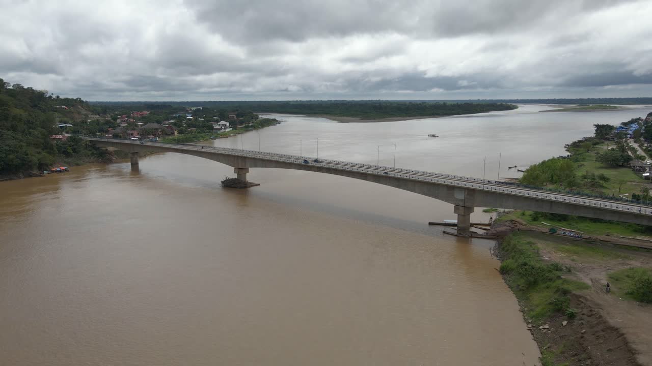 Bridge infrastructure over Alto Beni river in Rurrenabaque Bolivia car traffic, aerial drone view