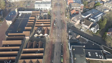 aerial of quiet road through suburban shopping district