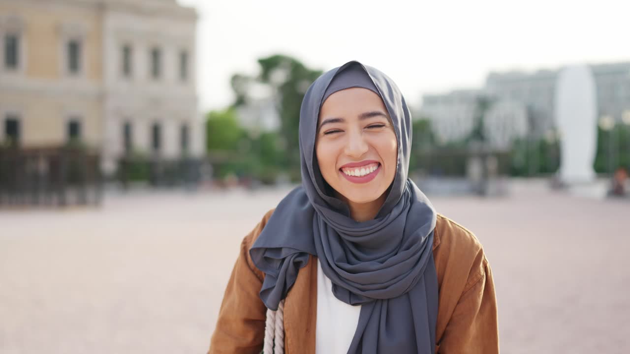 Joyful Muslim Woman in Hijab Celebrating Outdoors