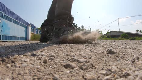 slow mo kick on ground with sands
