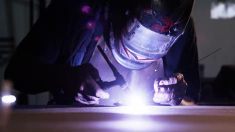 welder using welding torch