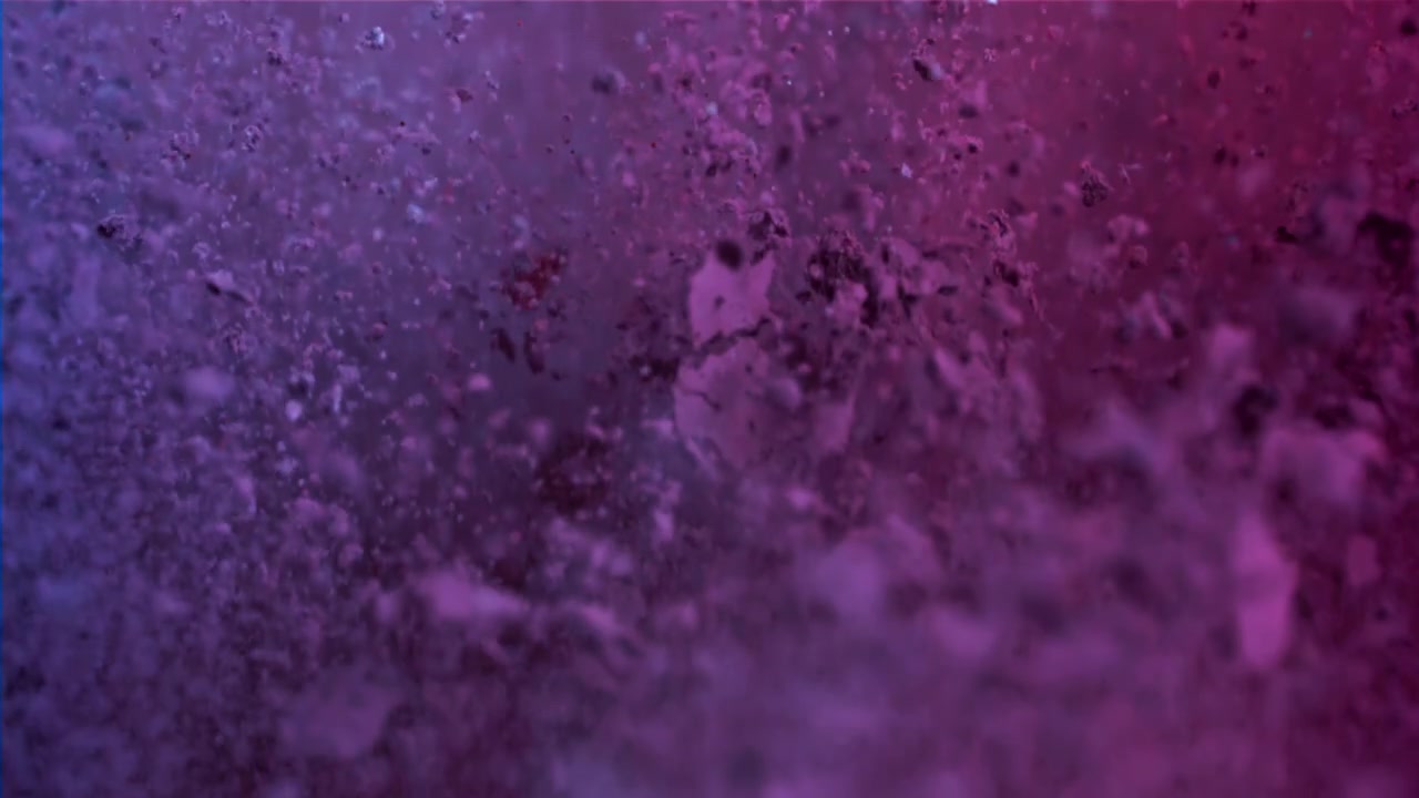 Vibrant Dust Particles Swirling in Abstract Purple and Pink Liquid