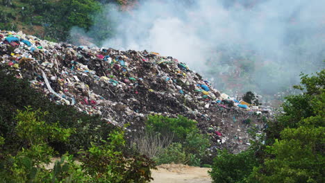 burning open air dump scene. vietnam. static