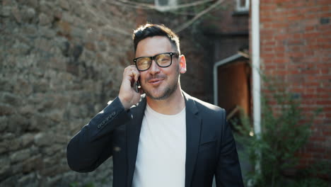 businessman talking on the phone outside