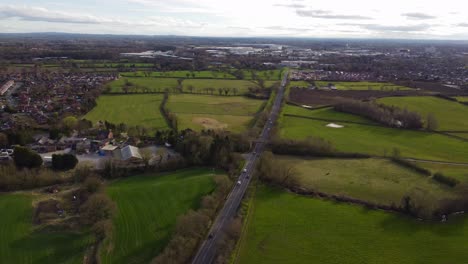 aerial view of a534 road across suburban countryside heading into crewe city centre - crewe, cheshire, uk