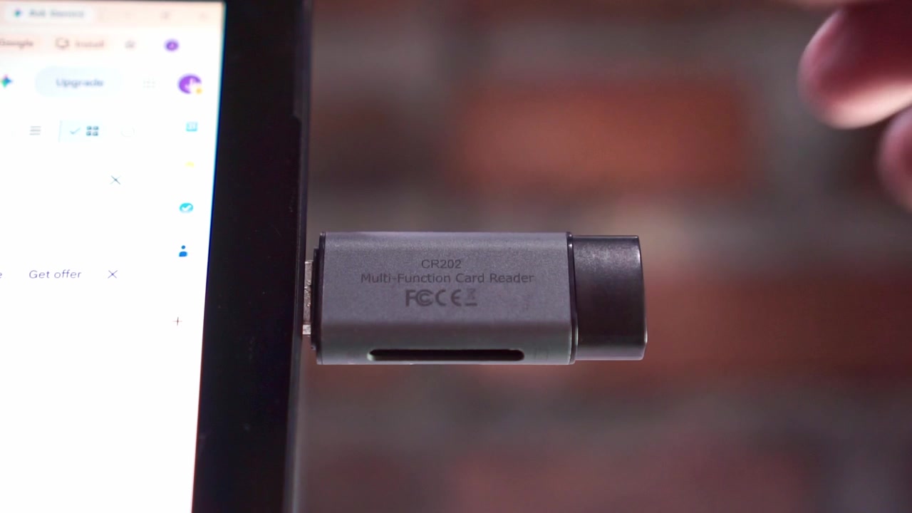 hand plugging USB flash drive into tablet, connecting card reader device, technology and data transfer concept.