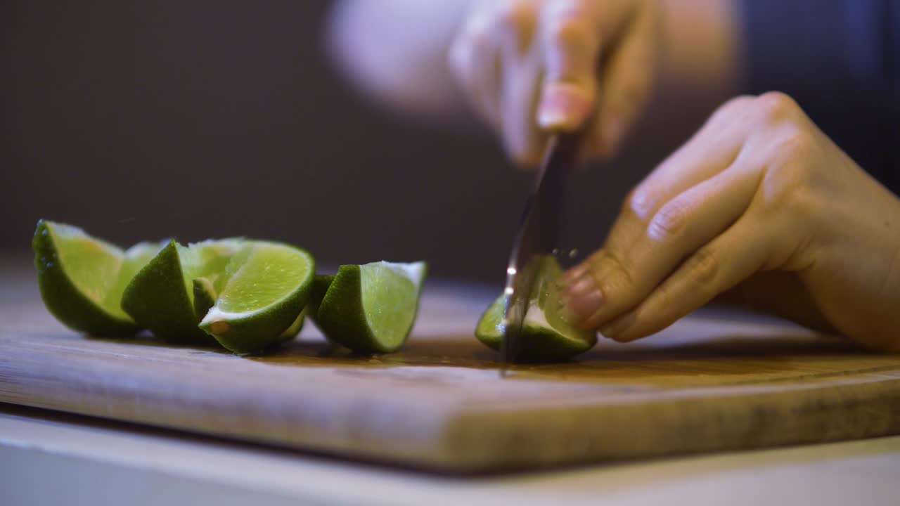 Cutting Limes on a Wooden Chopping Board