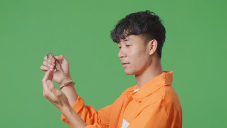 excited prisoner in orange jumpsuit