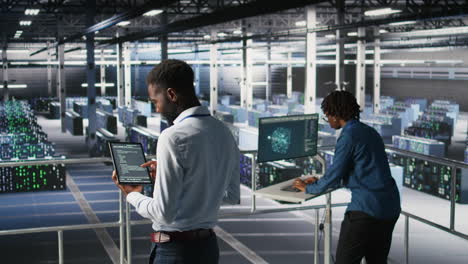 data center programmers on industrial platform checking lines of code