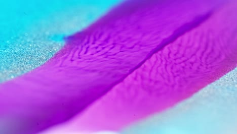 vivid purple ink flows into blue with a sparkling frost effect, resembling a vibrant river