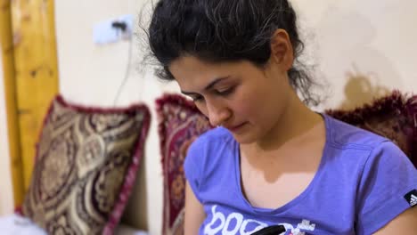 a young woman focused indoors