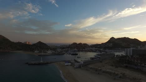 Aerial-shot-of-the-marina-of-Los-Cabos-at-sunset,-Baja-California-sur