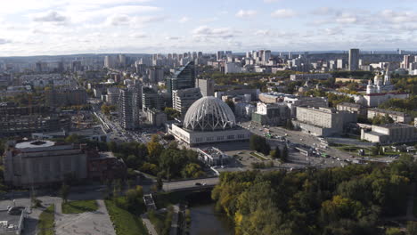 aerial view of a city with a dome-shaped building