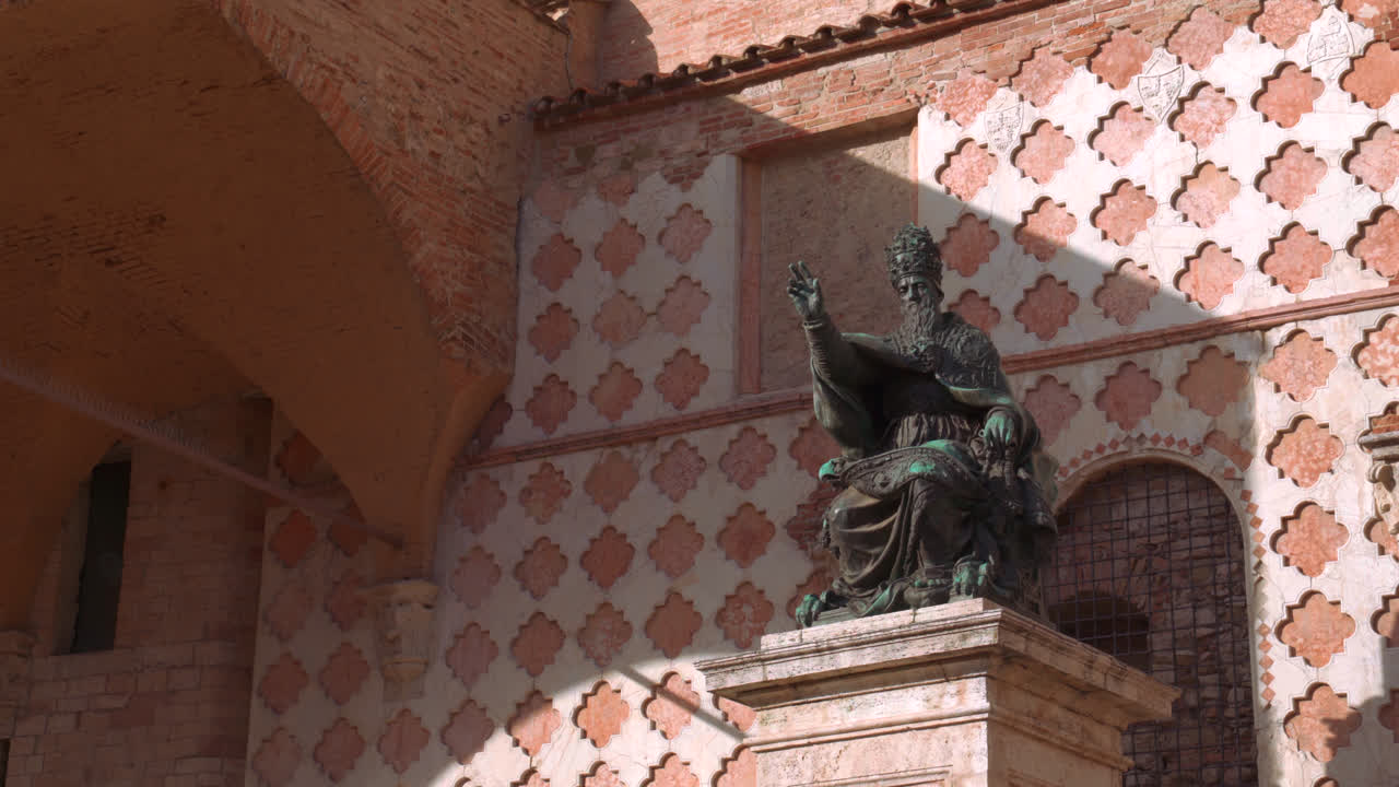 Close up of marble sculpture and ornate facade detail from historic building in Perugia