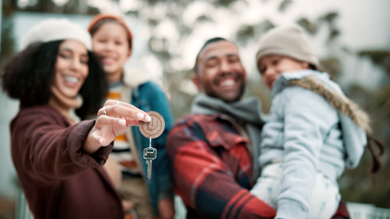 A happy family celebrates buying their new home