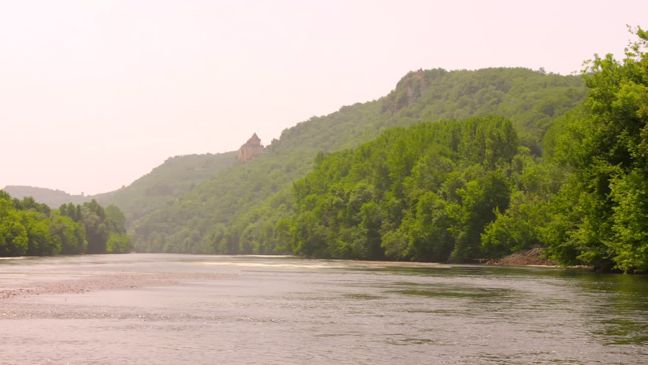Serene View Of A River With Historic Castle In Dordogne, France. Wide Shot