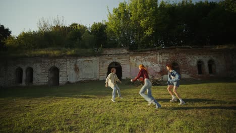 friends playing in abandoned ruins