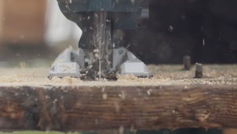 close up shot of wood getting cut by a jigsaw in slow-motion