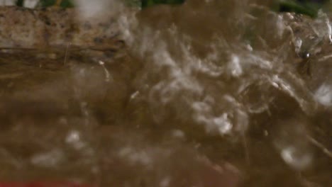 water splashes into fountain, close-up