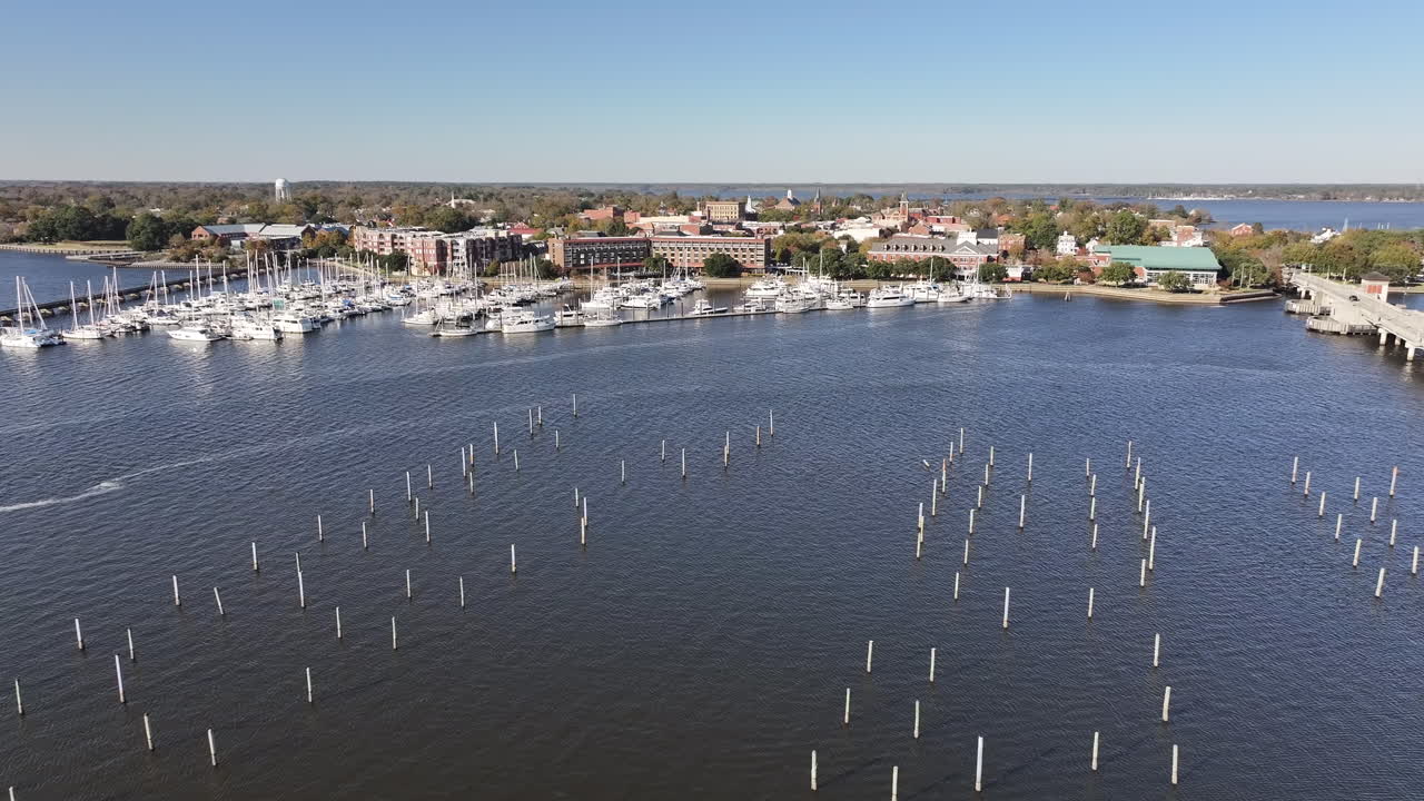 Drone shot the Downtown New Bern NC Waterfront area, with boats the marina , wide shot of river