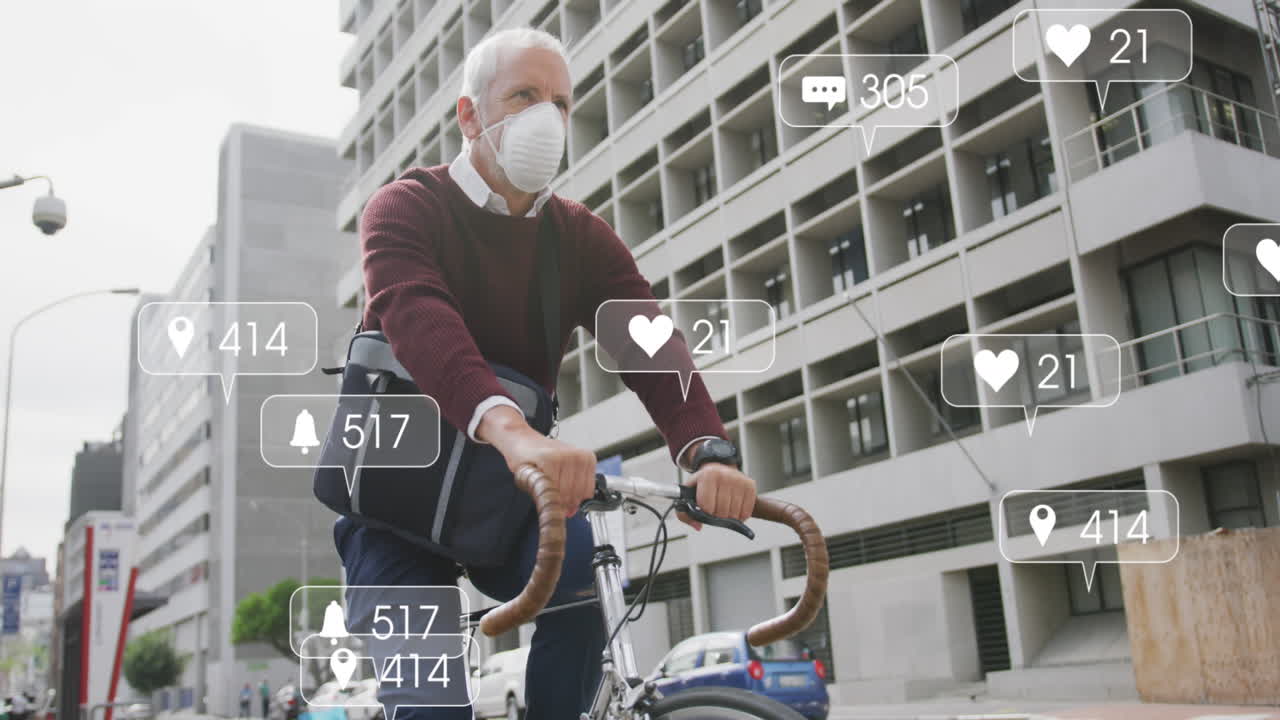 Animation of social media text and icons over caucasian man in face mask riding bike in city