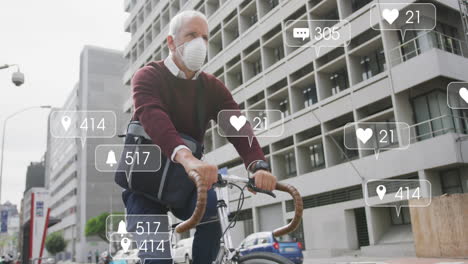 animation of social media text and icons over caucasian man in face mask riding bike in city