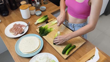 woman preparing a healthy wrap