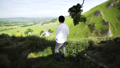 A-man-stood-at-a-view-point-in-Hope-Valley
