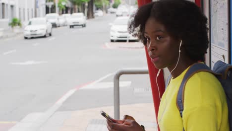 African-american-using-her-smartphone-in-street