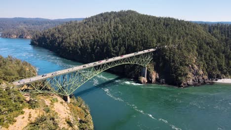 aerial orbiting shot of deception pass in washington connecting 2 islands