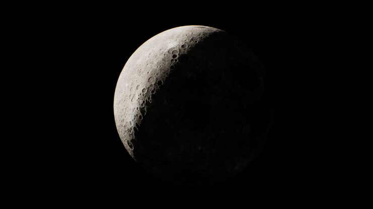Waxing crescent moon illuminated against dark night sky