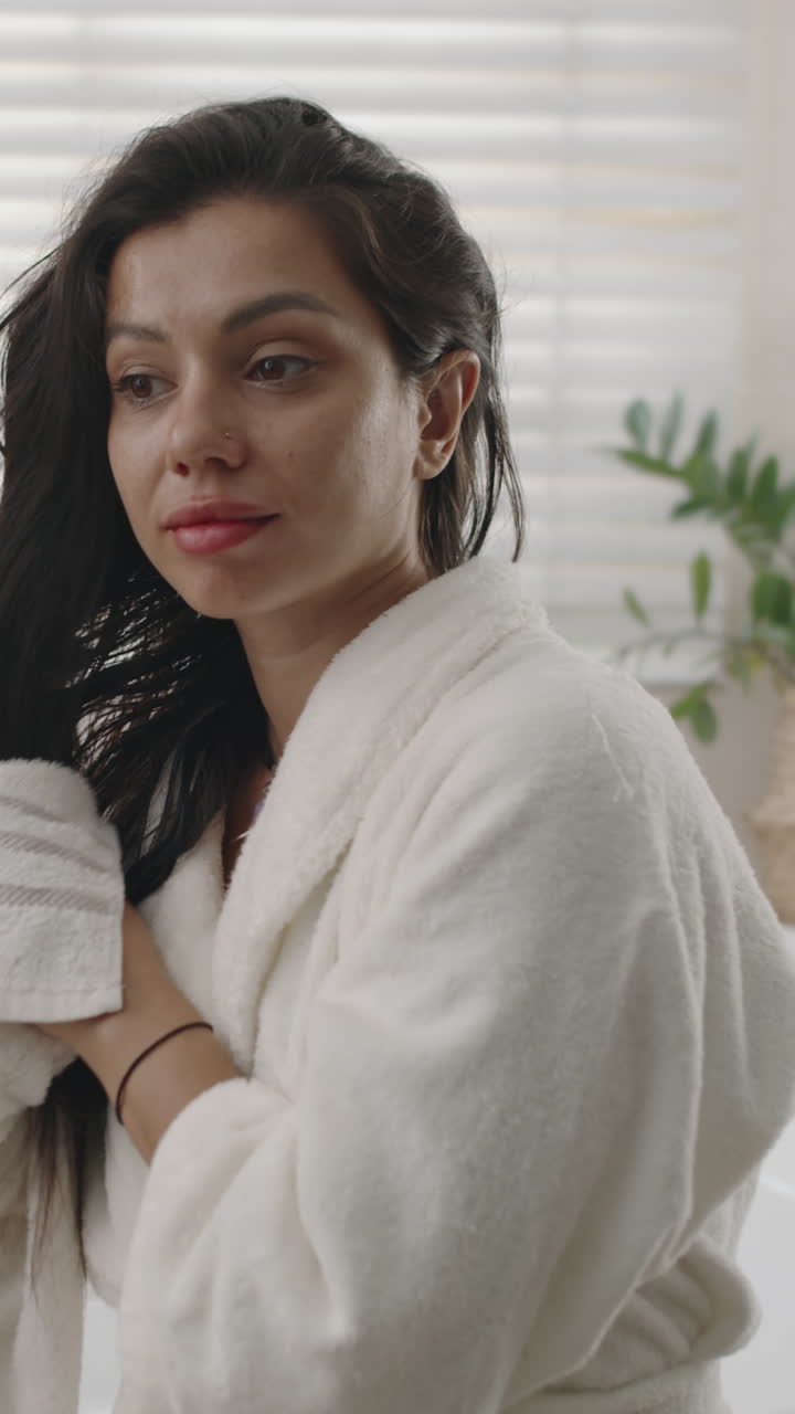 Female Brunette Wiping Hair with Towel