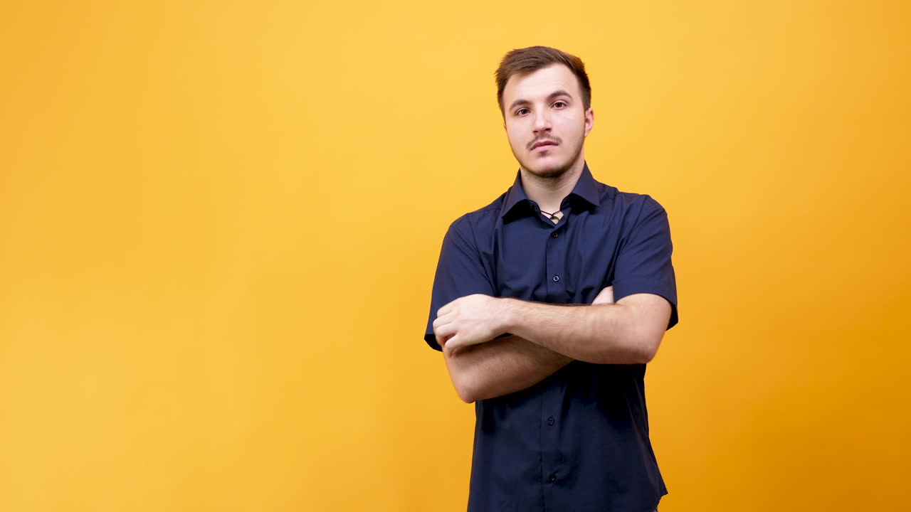 Portraits of a man in a blue shirt on a yellow background