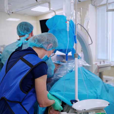 surgical team performing surgery in modern operation theater. working with surgical instruments.