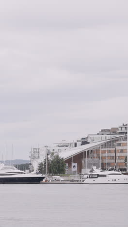 modern architecture and yachts in a harbor