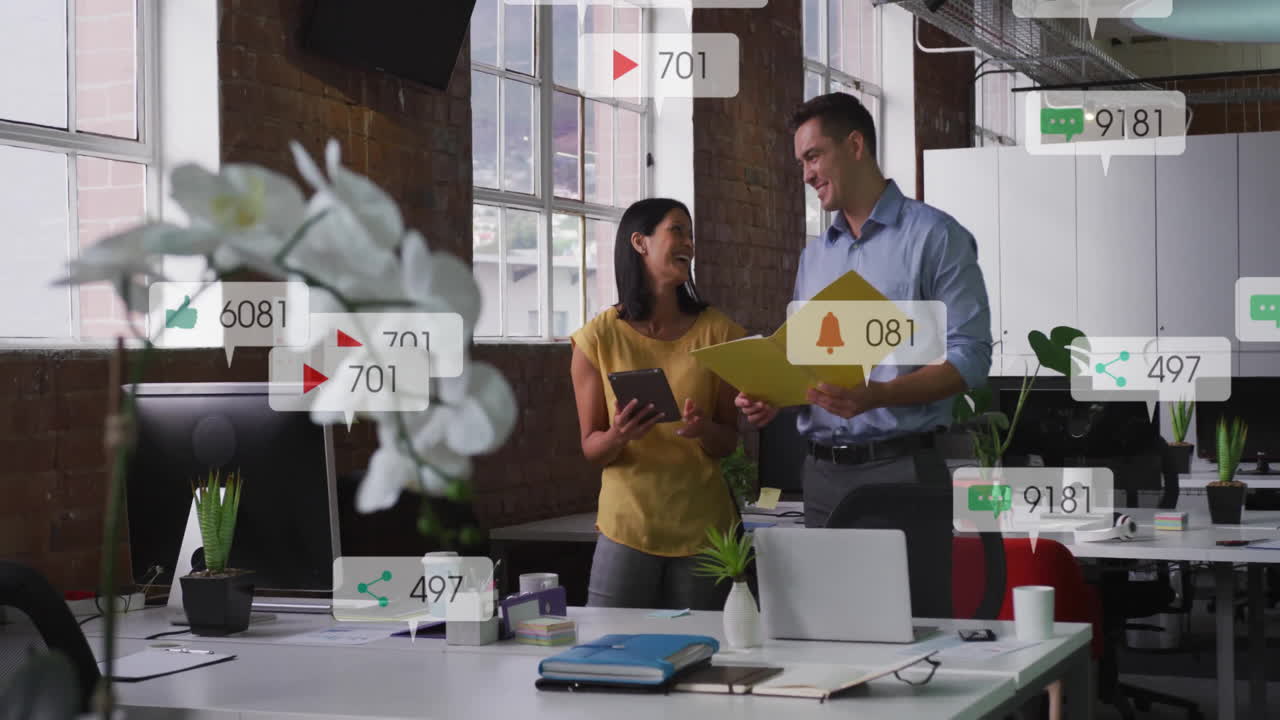 In office, colleagues discussing documents with animation of social media notifications