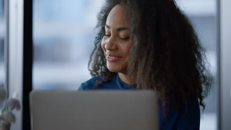 african american ceo woman enjoy working laptop drink morning coffee in office.