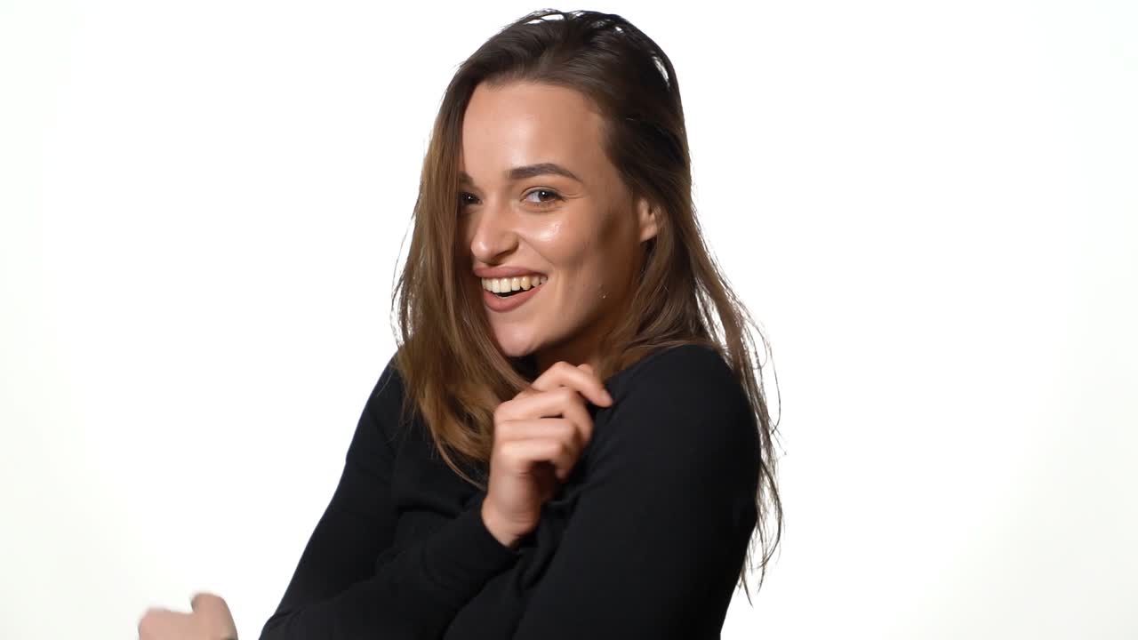 Shot of female model. Portrait of friendly woman smiling on isolated white background