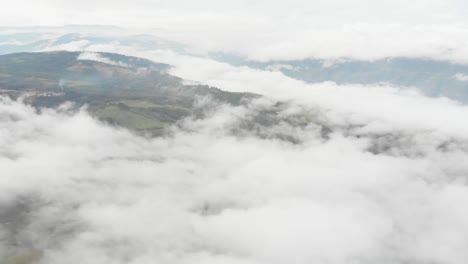 Pull-front-above-mist-in-a-field-at-morning-in-Colombia