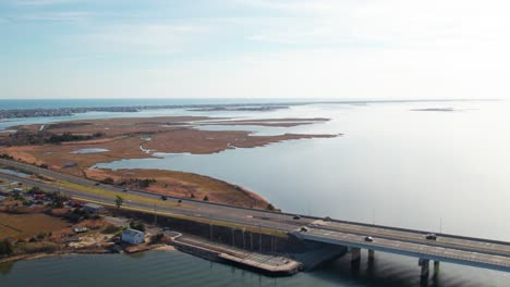 drone footage pan of causeway bridge to long beach island, new jersey