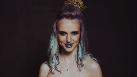 colourful studio shot of funny model girl. beauty woman portrait with colorful makeup and hair