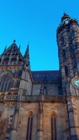 st. elisabeth cathedral in kosice, slovakia. low angle view at the ancient gothic building at sunset. vertical video.