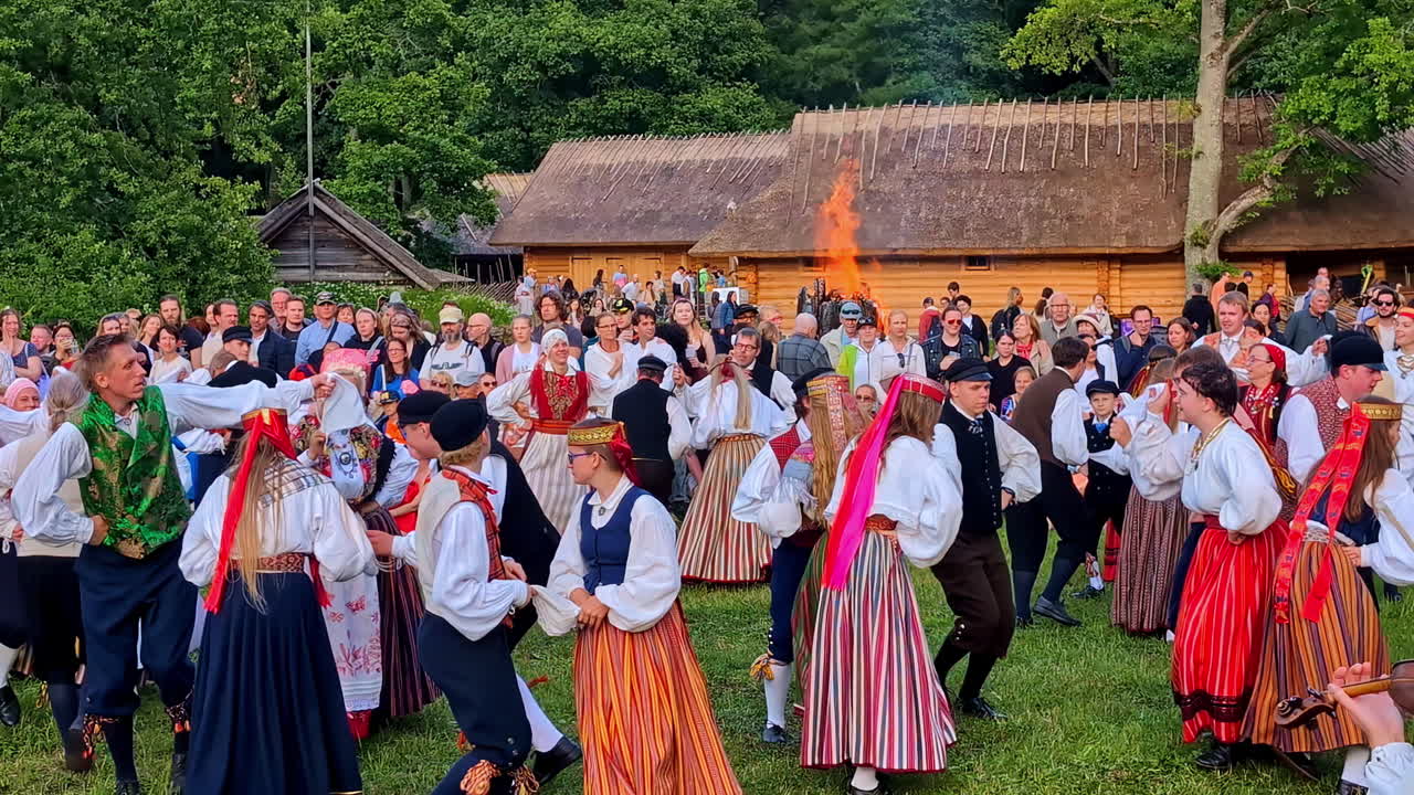Traditional Folk Dance and Bonfire Celebration at an Outdoor Festival